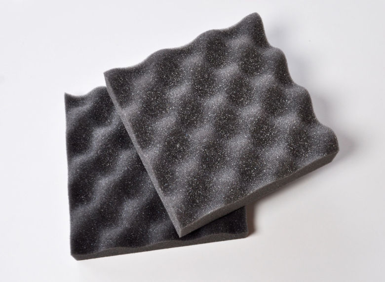 Dark grey convoluted foam sheets.
